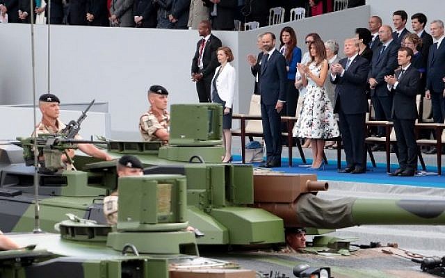In this file photo taken on July 14, 2017 French officials and US President Donald Trump watch as members of the 4th Foreign Regiment march in the annual Bastille Day military parade in Paris. (AFP PHOTO / Joel SAGET) In this file photo taken on July 14, 2017 French officials and US President Donald Trump watch as members of the 4th Foreign Regiment march in the annual Bastille Day military parade in Paris. (AFP PHOTO / Joel SAGET)