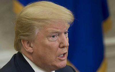 US President Donald Trump speaks to the press in the Oval Office of the White House in Washington, DC, February 9, 2018. SAUL LOEB/AFP)