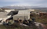 A picture taken on February 10, 2018, shows Israeli solders taking positions in the Golan Heights near the border with Syria. (AFP/ JALAA MAREY)