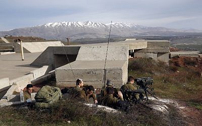 A picture taken on February 10, 2018, shows Israeli solders taking positions in the Golan Heights near the border with Syria. (AFP/ JALAA MAREY)
