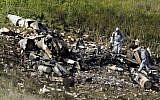 A picture taken in the northern Israeli Kibbutz of Harduf on February 10, 2018, shows the remains of an F-16 that crashed after coming under fire by Syrian air defenses (AFP Photo/Jack Guez)