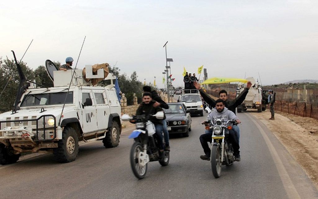 Hezbollah supporters rally in the area of Fatima's Gate in Kfar Kila on the Lebanese border with Israel on February 10, 2018 to celebrate the crashing of an Israeli air jet and to denounce the Israeli strikes on Syria. (AFP PHOTO / Ali DIA)