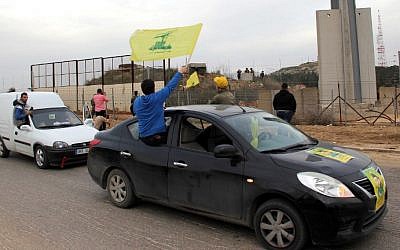 Hezbollah supporters rally near Fatima Gate in Kfar Kila on the Lebanese border with Israel on February 10, 2018, to celebrate the crash of an Israeli F-16 that came under fire from Syrian air defenses. (AFP Photo/Ali Dia)