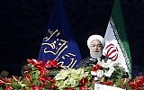 Iranian President Hassan Rouhani delivers a speech at the Azadi Square in the capital Tehran during a ceremony to mark the 39th anniversary of the Islamic revolution, on February 11, 2018. (AFP PHOTO / ATTA KENARE)