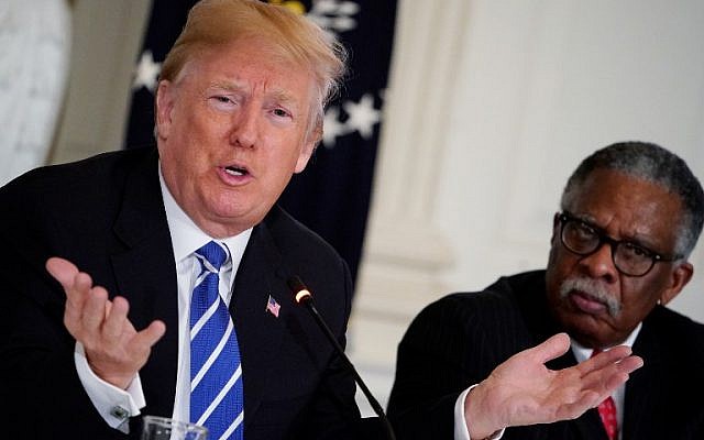 US President Donald Trump takes part in a meeting on infrastructure with state and local officials in the State Dining Room of the White House on February 12, 2018 in Washington, DC. At right is Vicksburg, Mississippi, Mayor George Flaggs. (AFP/ MANDEL NGAN) US President Donald Trump takes part in a meeting on infrastructure with state and local officials in the State Dining Room of the White House on February 12, 2018 in Washington, DC. At right is Vicksburg, Mississippi, Mayor George Flaggs. (AFP/ MANDEL NGAN)