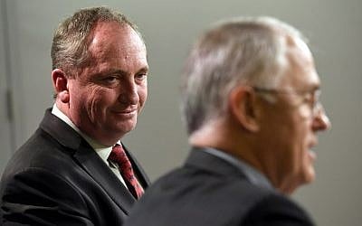 This file photo taken on July 5, 2016 shows Australia's Deputy Prime Minister Barnaby Joyce (L) looking at Prime Minister Malcolm Turnbull (R) during a press conference in Sydney. (AFP PHOTO / William WEST)