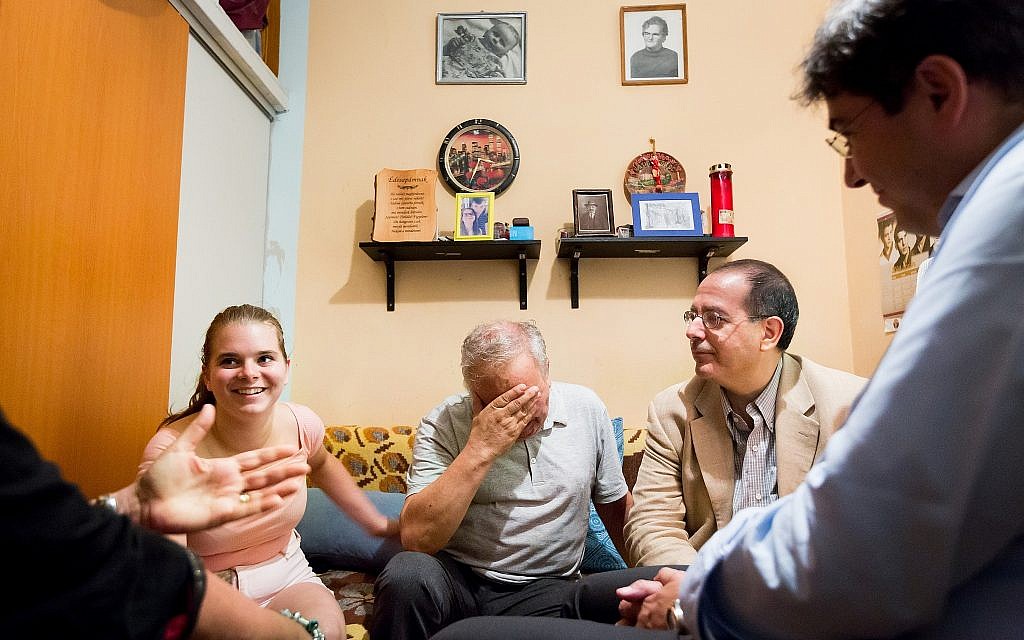 CEO of the American Jewish Joint Distribution Committee (JDC) David M. Schizer at a home visit with a family of impoverished Jews in Budapest. (courtesy)