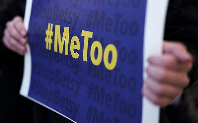 An activist holds a #MeToo sign during a news conference on a Title IX lawsuit outside the Department of Education January 25, 2018 in Washington, DC (Alex Wong/Getty Images/AFP) An activist holds a #MeToo sign during a news conference on a Title IX lawsuit outside the Department of Education January 25, 2018 in Washington, DC (Alex Wong/Getty Images/AFP)