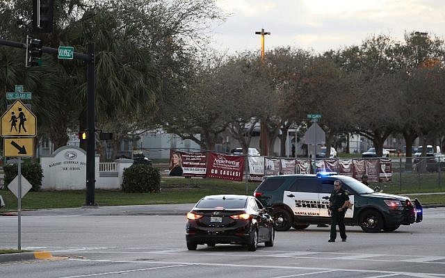 Police officers are seen in front of Marjory Stoneman Douglas High School as law enforcement officials investigate the mass shooting that took place at the school, on February 17, 2018, in Parkland, Florida. (Joe Raedle/Getty Images/AFP) Police officers are seen in front of Marjory Stoneman Douglas High School as law enforcement officials investigate the mass shooting that took place at the school, on February 17, 2018, in Parkland, Florida. (Joe Raedle/Getty Images/AFP)