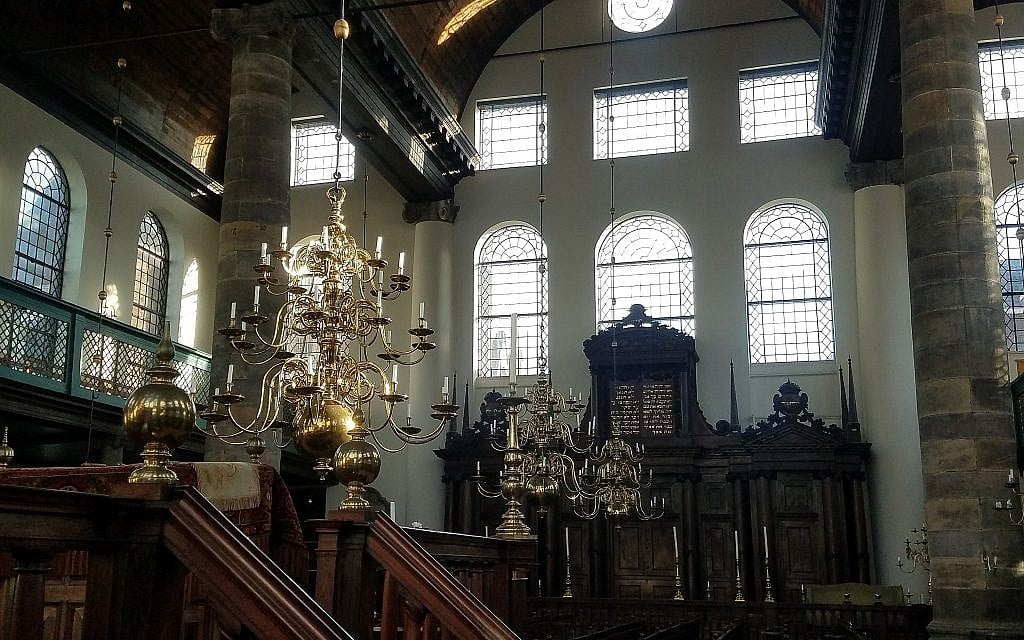 Interior of the Portuguese Synagogue in Amsterdam, the Netherlands, consecrated in 1675. The sanctuary, still without electricity, is lit by 1,000 candles for special occasions, January 2018 (Matt Lebovic/The Times of Israel) Interior of the Portuguese Synagogue in Amsterdam, the Netherlands, consecrated in 1675. The sanctuary, still without electricity, is lit by 1,000 candles for special occasions, January 2018 (Matt Lebovic/The Times of Israel)