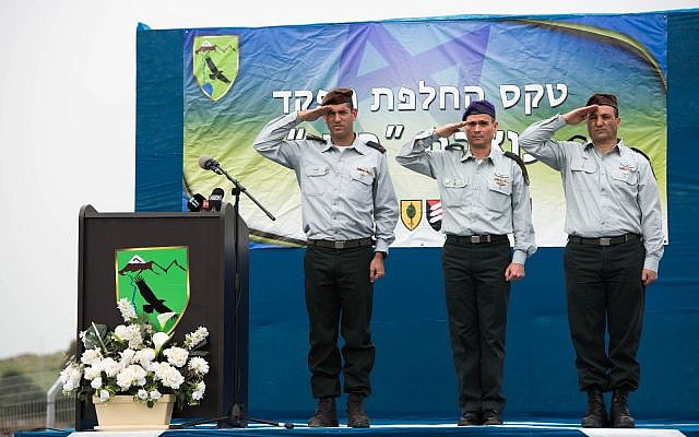 From left, incoming head of the IDF's 210th 'Bashan' Division, Brig. Gen. Amit Fisher; head of the Northern Command, Maj. Gen. Yoel Strick; and outgoing head of the 210th Division, Brig. Gen. Yaniv Assur, salute during a ceremony in the Nafah Army Base on the Golan Heights on February 11, 2018. (Israel Defense Forces) From left, incoming head of the IDF's 210th 'Bashan' Division, Brig. Gen. Amit Fisher; head of the Northern Command, Maj. Gen. Yoel Strick; and outgoing head of the 210th Division, Brig. Gen. Yaniv Assur, salute during a ceremony in the Nafah Army Base on the Golan Heights on February 11, 2018. (Israel Defense Forces)