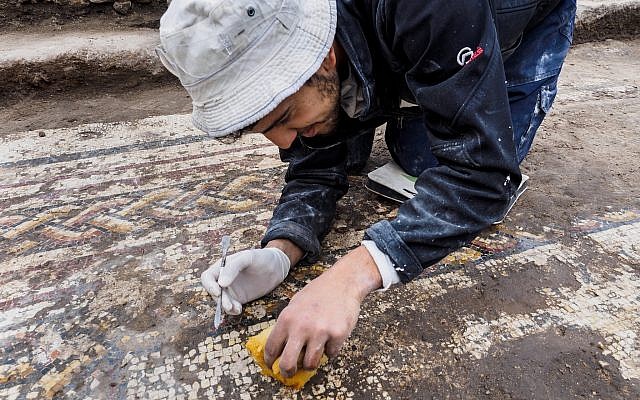A rare Roman mosaic from the 2nd–3rd centuries CE, bearing an inscription in ancient Greek, uncovered in Caesarea during conservation work by the Israel Antiquities Authority. (Assaf Peretz, Israel Antiquities Authority)