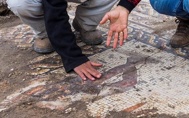 A rare Roman mosaic from the 2nd–3rd centuries CE, bearing an inscription in ancient Greek, uncovered in Caesarea during conservation work by the Israel Antiquities Authority. (Assaf Peretz, Israel Antiquities Authority)