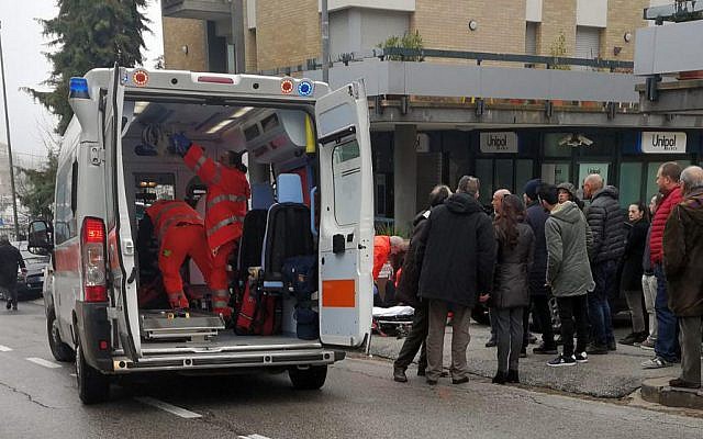 Paramedics attend a wounded man after a shooting broke out in Macerata, Italy, Saturday, Feb. 3, 2018 (Guido Picchio/ANSA via AP) Paramedics attend a wounded man after a shooting broke out in Macerata, Italy, Saturday, Feb. 3, 2018 (Guido Picchio/ANSA via AP)