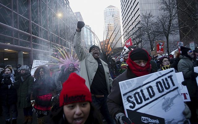 Protesters en route to US Bank Stadium, where an 'Anti-Racist Anti-Corporate' rally joined with 'Take a Knee Nation,' in Minneapolis, Sunday, February 4, 2018. (David Joles/Star Tribune via AP) Protesters en route to US Bank Stadium, where an 'Anti-Racist Anti-Corporate' rally joined with 'Take a Knee Nation,' in Minneapolis, Sunday, February 4, 2018. (David Joles/Star Tribune via AP)