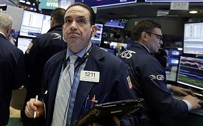 Trader Tommy Kalikas works on the floor of the New York Stock Exchange, Monday, February 5, 2018. (AP Photo/Richard Drew)