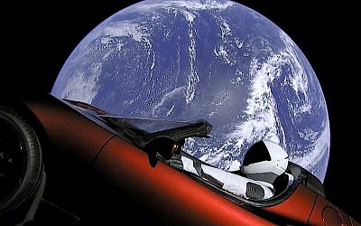 This image from video provided by SpaceX shows the company's spacesuit in Elon Musk's red Tesla sports car which was launched into space during the first test flight of the Falcon Heavy rocket on February 6, 2018. (SpaceX via AP)