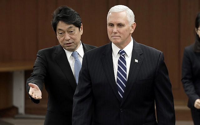 US Vice President Mike Pence, right, is shown the way by Japanese Defense Minister Itsunori Onodera, left, prior to a meeting at Defense Ministry in Tokyo Wednesday, February 7, 2018. (AP Photo/Shizuo Kambayashi, Pool) US Vice President Mike Pence, right, is shown the way by Japanese Defense Minister Itsunori Onodera, left, prior to a meeting at Defense Ministry in Tokyo Wednesday, February 7, 2018. (AP Photo/Shizuo Kambayashi, Pool)
