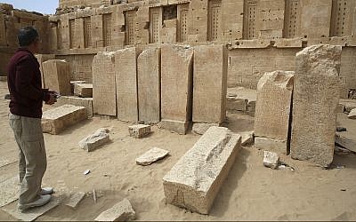 In this February 3, 2018 photograph, a Yemeni official explores the Awwam Temple, also known as the Mahram Bilqis, in Marib, Yemen. (AP Photo/Jon Gambrell)