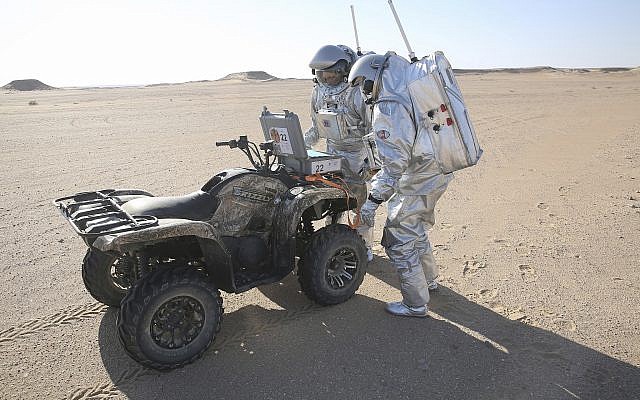 Two scientists test space suits and a geo-radar for use in a future Mars mission, Dhofar desert, southern Oman, February 7, 2018. (AP Photo/Sam McNeil)