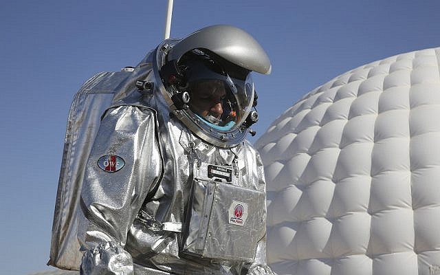 Analog astronaut Kartik Kumar wears an experimental space suit during a simulation of a future Mars mission, Dhofar desert, southern Oman, February 7, 2018. (AP Photo/Sam McNeil)