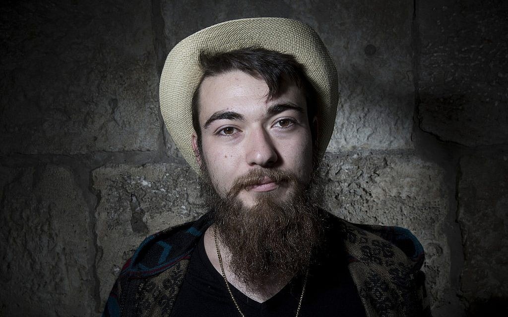 Sebastian Tutual poses for a portrait in Jerusalem's Old City, February 11, 2018. (AP Photo/Oded Balilty)