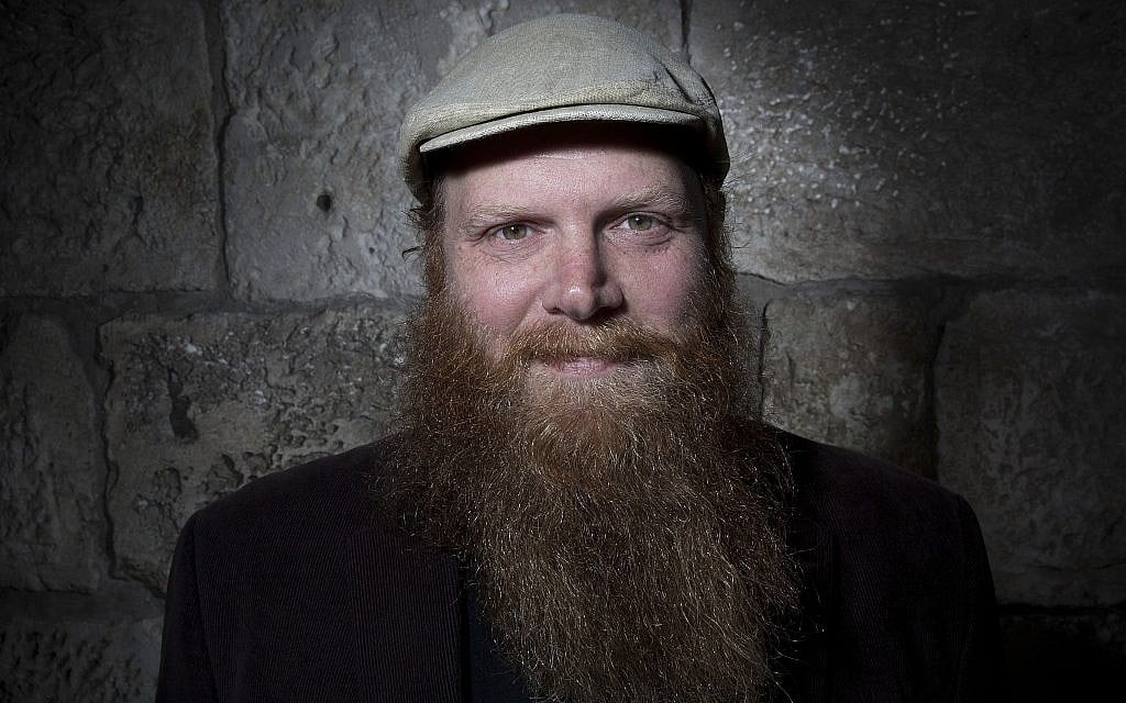 Eitan Press of Aleph Male, a beard balm business based on Jewish masculinity, in Jerusalem's Old City, February 11, 2018. (AP Photo/Oded Balilty)