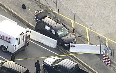 In this image made from video and provided by WUSA TV-9, authorities investigate the scene of a shooting at Fort Meade, Maryland, on February 14, 2018. (WUSA TV-9 via AP)