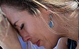 A woman cries as she bows her head in prayer during a vigil at the Parkland Baptist Church, for the victims of the Wednesday shooting at Marjory Stoneman Douglas High School, in Parkland, Florida on February 15, 2018. (AP Photo/Gerald Herbert)