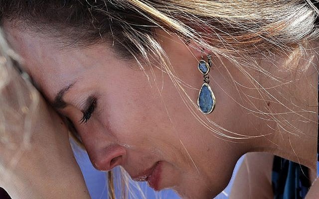 A woman cries as she bows her head in prayer during a vigil at the Parkland Baptist Church, for the victims of the Wednesday shooting at Marjory Stoneman Douglas High School, in Parkland, Florida on February 15, 2018. (AP Photo/Gerald Herbert) A woman cries as she bows her head in prayer during a vigil at the Parkland Baptist Church, for the victims of the Wednesday shooting at Marjory Stoneman Douglas High School, in Parkland, Florida on February 15, 2018. (AP Photo/Gerald Herbert)