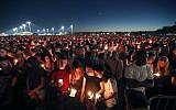 People attend a candlelight vigil for the victims of the Wednesday shooting at Marjory Stoneman Douglas High School, in Parkland, Florida,, February 15, 2018. (AP Photo/Gerald Herbert)