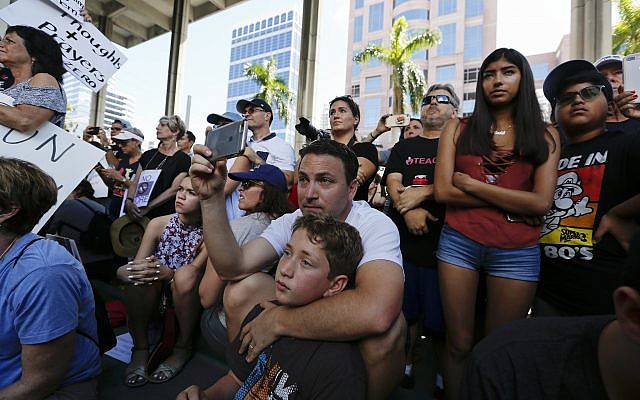 Demonstrators at protest against guns on the steps of the Broward County Federal courthouse in Fort Lauderdale, Florida, on Saturday, February 17, 2018. (AP Photo/Brynn Anderson)