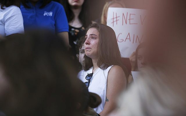 Demonstrators at protest against guns on the steps of the Broward County Federal courthouse in Fort Lauderdale, Florida, on Saturday, February 17, 2018. (AP Photo/Brynn Anderson)