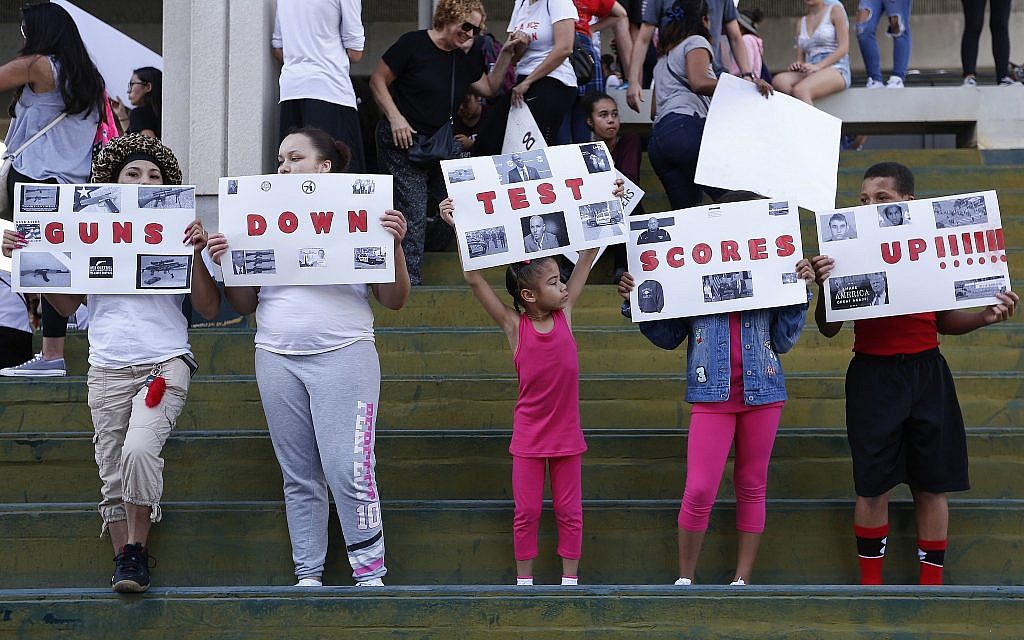 Demonstrators at protest against guns on the steps of the Broward County Federal courthouse in Fort Lauderdale, Florida, on Saturday, February 17, 2018. (AP Photo/Brynn Anderson)