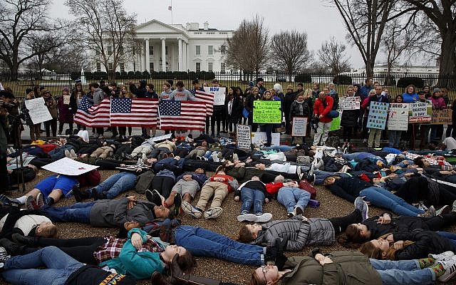 Demonstrators participate in a "lie-in" during a protest in favor of gun control reform in front of the White House, Monday, Feb. 19, 2018, in Washington. (AP Photo/Evan Vucci) Demonstrators participate in a "lie-in" during a protest in favor of gun control reform in front of the White House, Monday, Feb. 19, 2018, in Washington. (AP Photo/Evan Vucci)