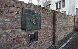 A fragment of the former Warsaw Ghetto wall in Sienna 53 street that regional official for preservation of historical sites wants put on a list of protected historical monuments, in Warsaw, Poland, Tuesday, Feb. 20, 2018 (AP Photo/Czarek Sokolowski)