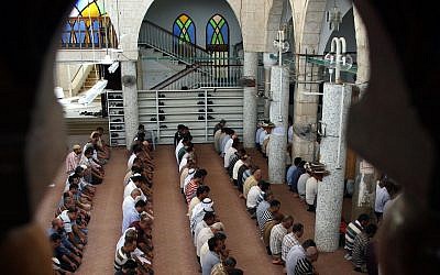 Palestinian worshipers are seen praying in a mosque in Jenin. (AP Photo/Mohammed Ballas/File)