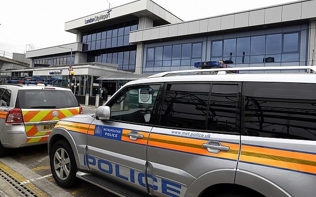 Police cars parked outside London City Airport, September 6, 2016. (AP Photo/Kirsty Wigglesworth)