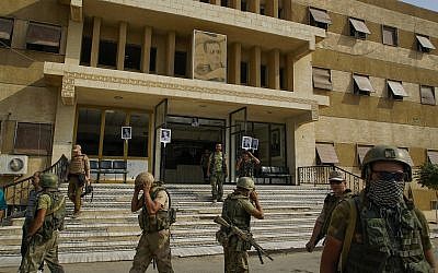 In this Friday, Sept. 15, 2017 photo Russian military police soldiers walk out side a hospital in Deir el-Zour, Syria. (AP Photo)