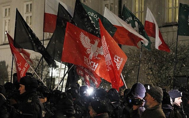 Far-right groups hold a demonstration in front of the presidential palace to call on President Andrzej Duda to sign the bill that limits some forms of Holocaust speech in Warsaw, Poland, February 5, 2018. (AP Photo/Czarek Sokolowski) Far-right groups hold a demonstration in front of the presidential palace to call on President Andrzej Duda to sign the bill that limits some forms of Holocaust speech in Warsaw, Poland, February 5, 2018. (AP Photo/Czarek Sokolowski)