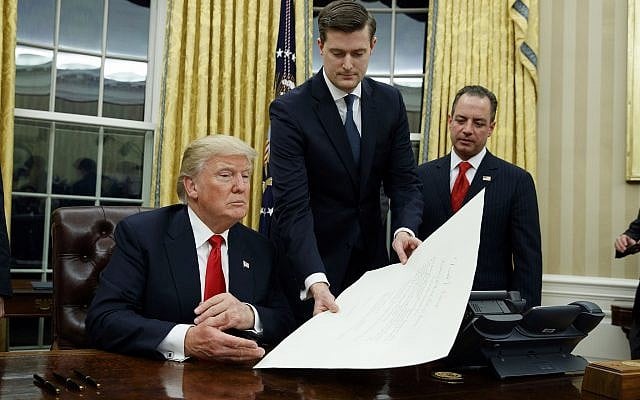 FILE - In this Jan. 20, 2017 file photo, White House Staff Secretary Rob Porter, center, hands President Donald Trump a confirmation order for James Mattis as defense secretary, in the Oval Office of the White House in Washington, as White House Chief of Staff Reince Priebus, right, watches. AP Photo/Evan Vucci) FILE - In this Jan. 20, 2017 file photo, White House Staff Secretary Rob Porter, center, hands President Donald Trump a confirmation order for James Mattis as defense secretary, in the Oval Office of the White House in Washington, as White House Chief of Staff Reince Priebus, right, watches. AP Photo/Evan Vucci)