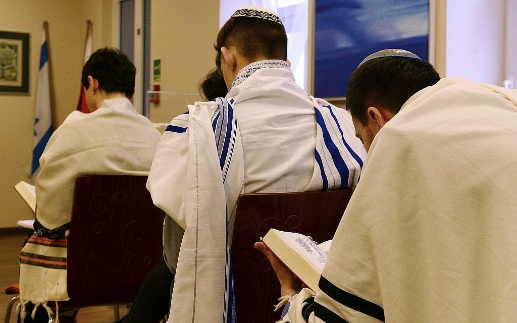 Illustrative photo of Jewish people praying in a synagogue in Warsaw, Poland, on February 10, 2018. (AP Photo/Alik Keplicz) Illustrative photo of Jewish people praying in a synagogue in Warsaw, Poland, on February 10, 2018. (AP Photo/Alik Keplicz)