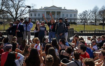 Illustrative image of demonstrators taking part in a student protest for gun control legislation in front of the White House,, February 21, 2018, in Washington. (AP Photo/Evan Vucci)