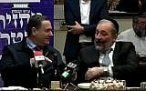 Transport Minister Israel Katz (Likud, left) and Interior Minister Aryeh Deri (Shas) joke about Prime Minister Benjamin Netanyahu's incredible luck, on February 26, 2018. (Screen capture: Knesset Channel)