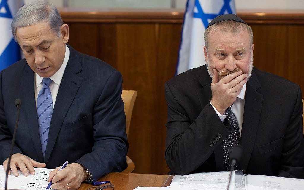 Prime Minister Benjamin Netanyahu (left) and Attorney General Avichai Mandelblit at a July 2015 cabinet meeting, when Mandelblit was serving as cabinet secretary. (Emil Salman/Pool) Prime Minister Benjamin Netanyahu (left) and Attorney General Avichai Mandelblit at a July 2015 cabinet meeting, when Mandelblit was serving as cabinet secretary. (Emil Salman/Pool)