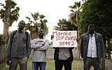 Illustrative image of African asylum seekers attending a memorial ceremony to commemorate 14 years since the genocide in Darfur, at Levinsky Park in southern Tel Aviv on Thursday, April 27 2017. (Tomer Neuberg/Flash90)