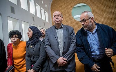 The parents of Mohammed Abu Khdeir seen with Arab-Israeli parliament member Saadia Osama (R) as they arrive at the Supreme Court in Jerusalem, on February 7, 2018. (Yonatan Sindel/Flash90)