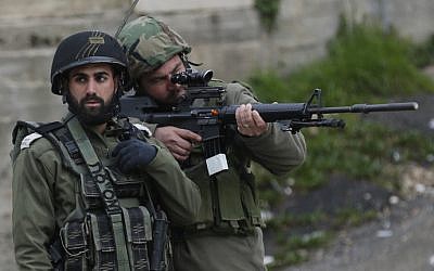 Illustrative: Israeli security forces in the West Bank on February 17, 2018 (Wisam Hashlamoun/FLASH90)