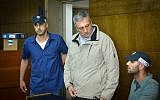Nir Hefetz arrives for extension of his remand in case 4000 at the District Court in Tel Aviv, February 22, 2018. (Flash90)