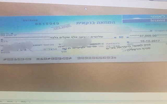 Forged check used to purchase secondhand goods, according to a police statement on February 19, 2018. (Israel police) Forged check used to purchase secondhand goods, according to a police statement on February 19, 2018. (Israel police)
